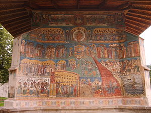The Last Judgment, painting in Byzantine Orthodox style on the walls of the Vorone monasteries?  built in 1488 in Romania.  On the left we see paradise with the saints and the Tree of Life, on the right the hells with demons and the fire which descends into the abyss and above the contemplative image of the Almighty Christ.  To the right and left of Christ are the signs of the zodiac.